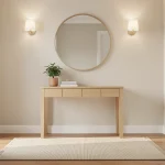 Entrée lumineuse avec console en bois clair, miroir rond et tapis texturé
